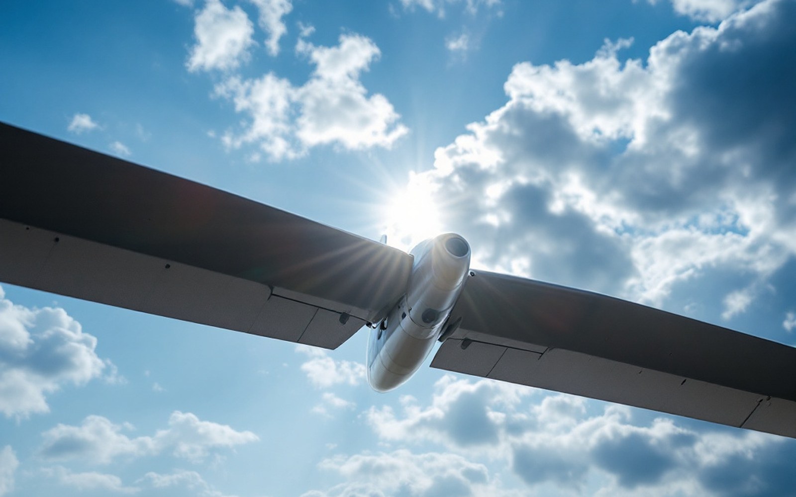 A rotor blade seen end-on against the sky showing its aerofoil section